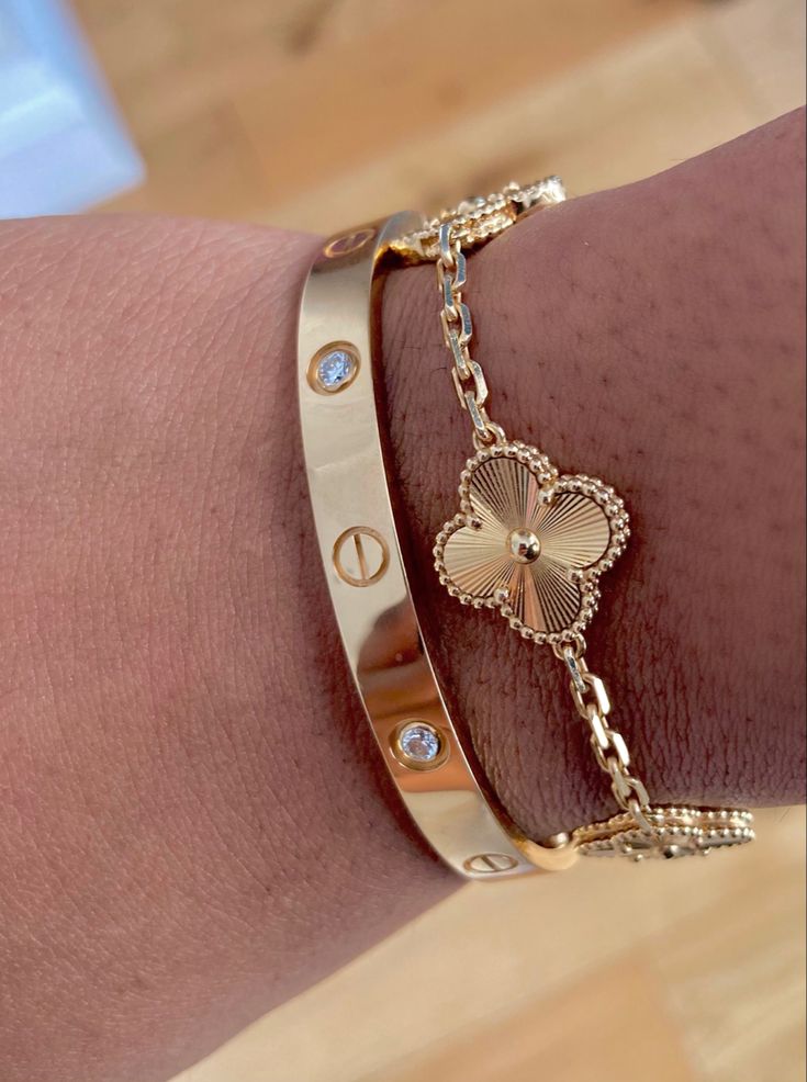 Cartier love bangle with golden clover bracelet