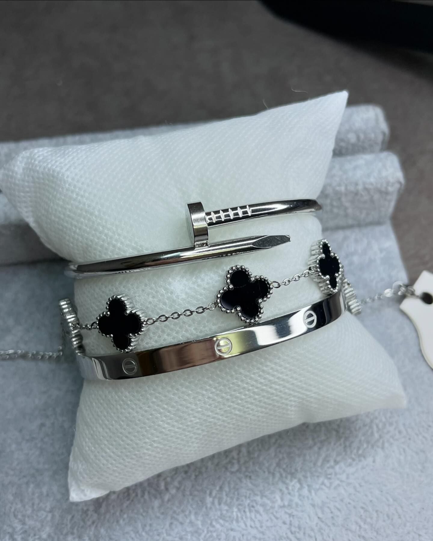 Silver Cartier Nail and love bangle with black clover bracelet