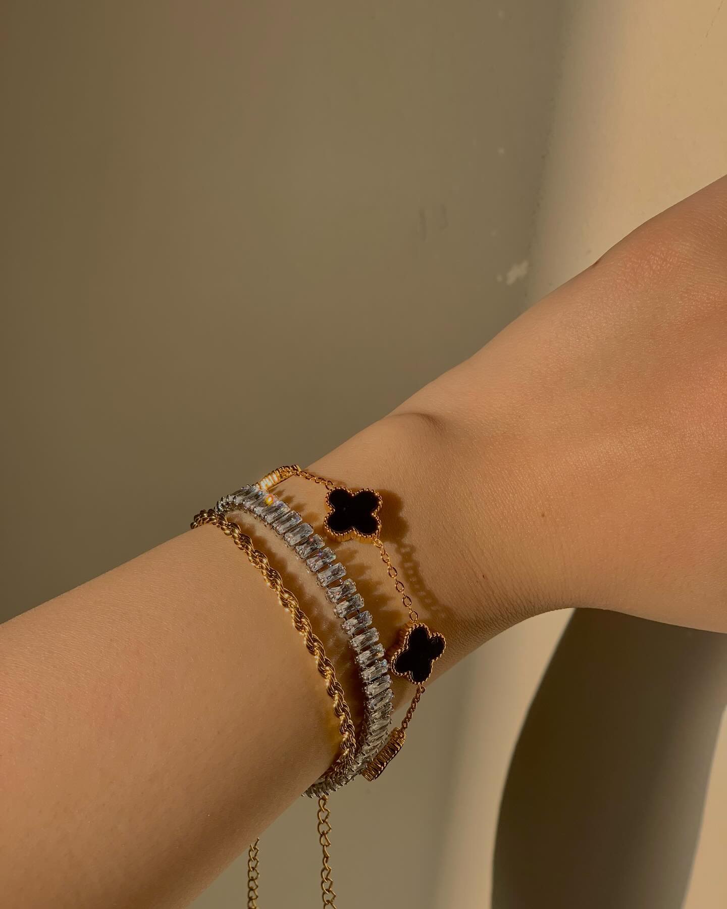 Black clover, tennis and twisted bracelet stack