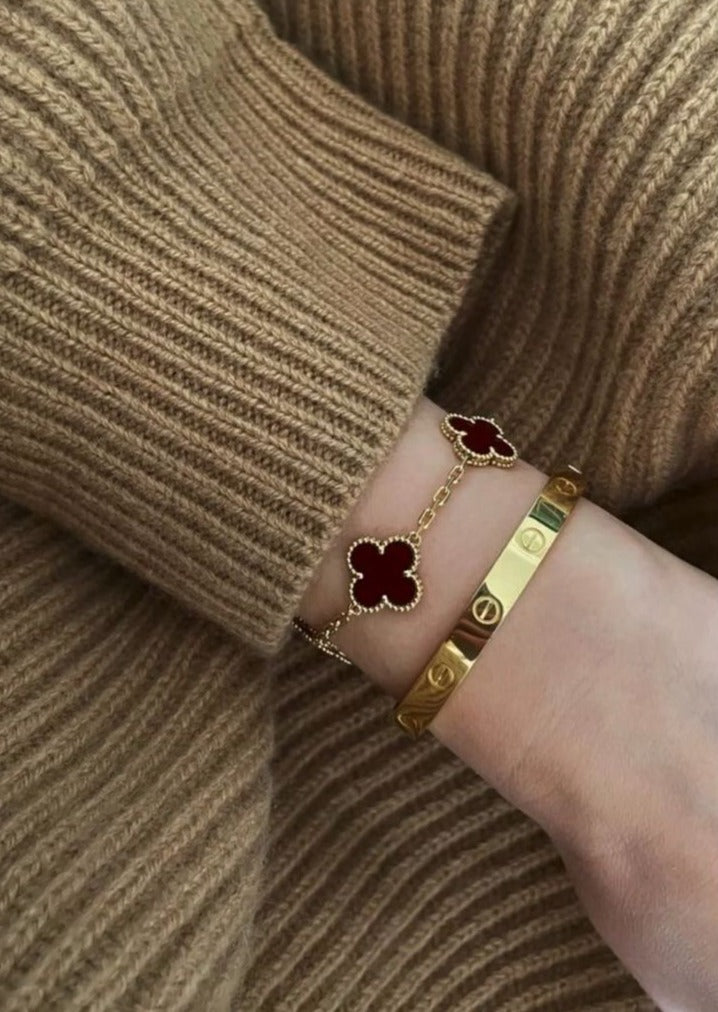 Cartier Love bangle with red clover bracelet